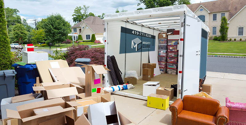 Portable storage unit being loaded